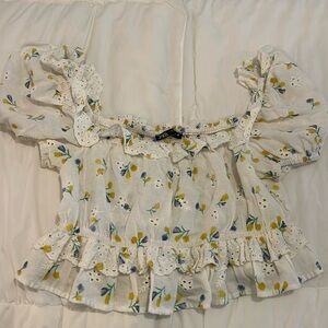 Adorable Zara top with eyelet detail, ruffles, and purple and yellow flowers